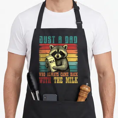 Racoon alway milk aprons - Raccoon holding milk carton with striped retro background and distressed text — shown on a black cotton canvas apron against a white background