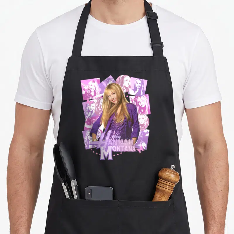 Montana iconic aprons - Hannah Montana photo collage with purple and pink tinted portraits and stylized text logo — shown on a black cotton canvas apron against a white background