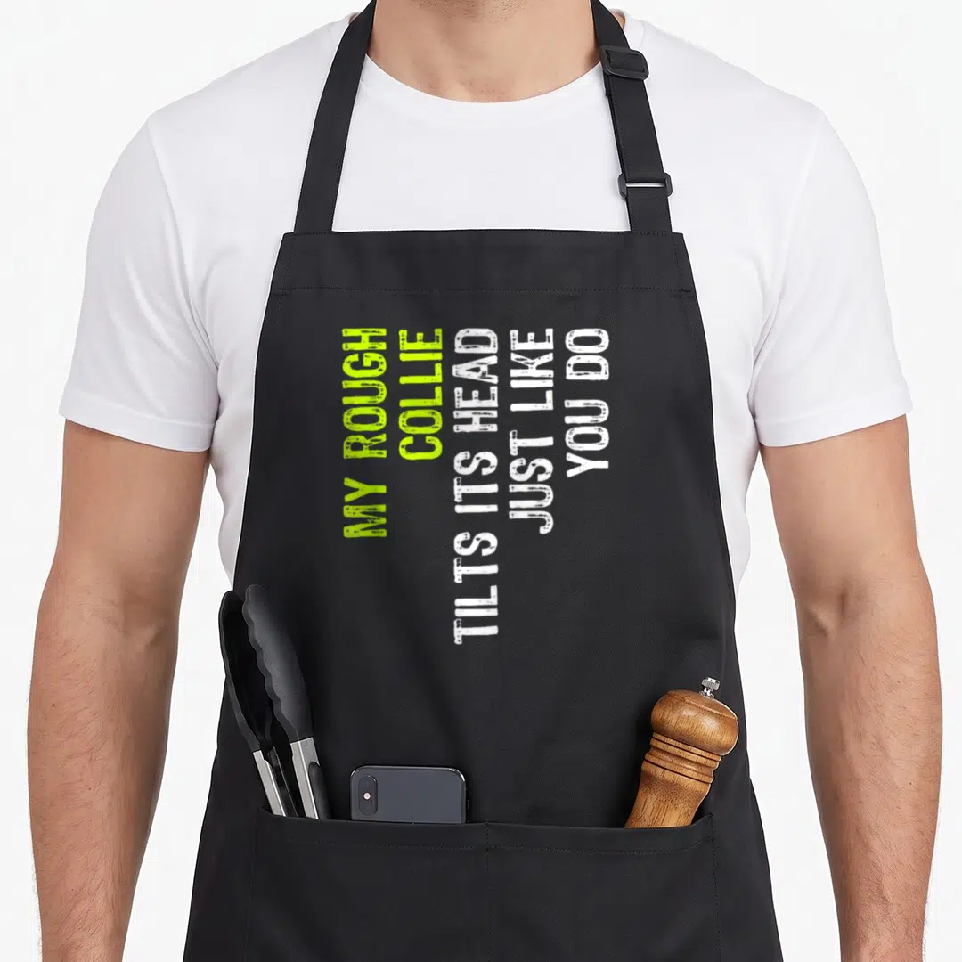 Collie tilt dog apron - Stacked text MY ROUGH COLLIE TILTS ITS HEAD JUST LIKE YOU DO in lime and white — shown on a black cotton canvas apron against a white background