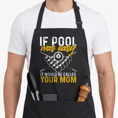 Pool easy apron - Distressed text above and below a triangle of pool balls with two crossed cues — shown on a black cotton canvas apron against a white background
