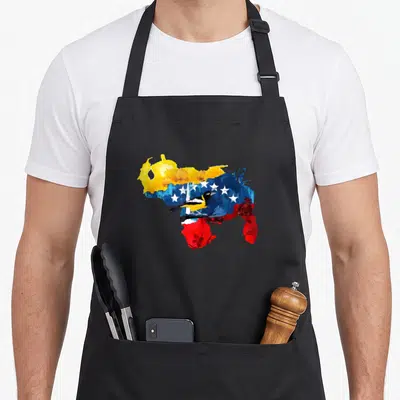Venezuelan colored aprons - Watercolor map of Venezuela in yellow blue red with bird and white stars — shown on a black cotton canvas apron against a white background