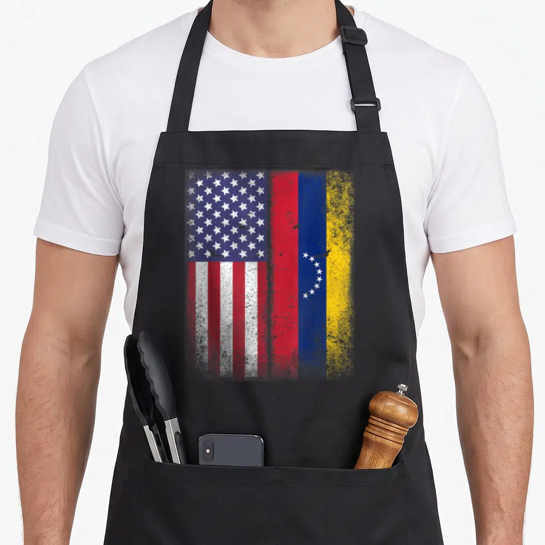 Venezuela american flag apron - Merged US and Venezuelan flags in red white blue and yellow with distressed texture — shown on a black cotton canvas apron against a white background