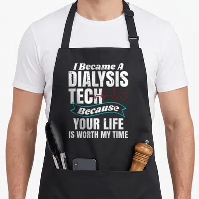 Dialysis son life apron - Stacked white text I Became A Dialysis Tech with red heartbeat line and blue ribbon on black — shown on a black cotton canvas apron against a white background