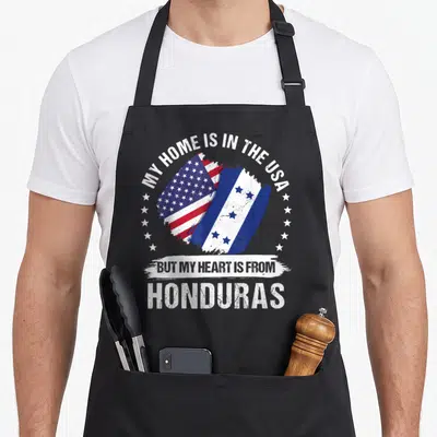 Honduras patriots apron - Merged US and Honduras flags in brush stroke with distressed text and star semi-circle — shown on a black cotton canvas apron against a white background