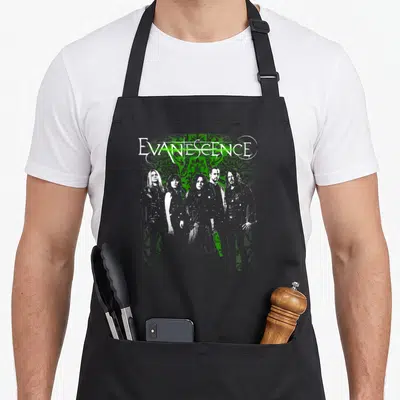 Evanescence big band apron - White EVANESCENCE text over green ornamental pattern with five band members standing — shown on a black cotton canvas apron against a white background