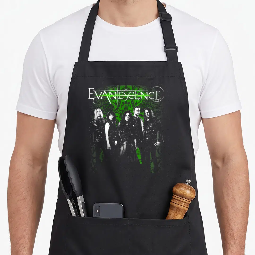 Evanescence big band apron - White EVANESCENCE text over green ornamental pattern with five band members standing — shown on a black cotton canvas apron against a white background