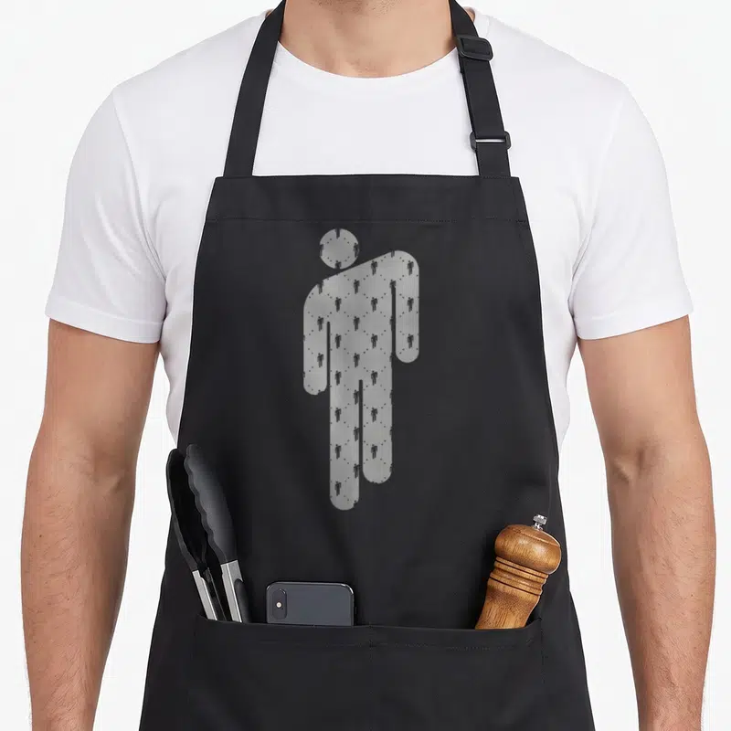 Billie black apron - Large grey silhouette filled with pattern of smaller person shapes — shown on a black cotton canvas apron against a white background