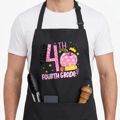 Hello 4th teacher apron - Pink leopard 4 with floral apple pencil crown and HELLO FOURTH GRADE text — shown on a black cotton canvas apron against a white background