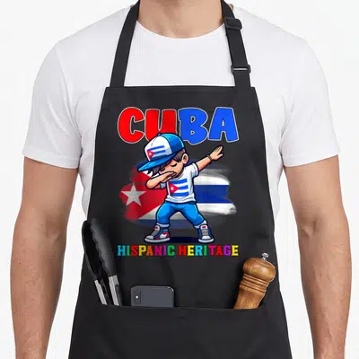 Dabbing hispanic aprons - Cartoon boy dabbing in front of Cuban flag with CUBA and HISPANIC HERITAGE text — shown on a black cotton canvas apron against a white background