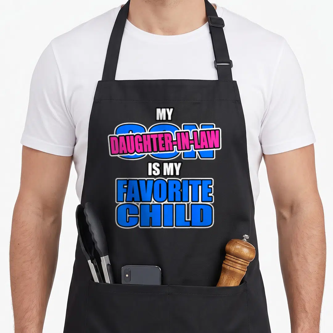Replaced mom and daughter aprons - My Son Daughter-in-Law Is My Favorite Child text art in blue and pink — shown on a black cotton canvas apron against a white background