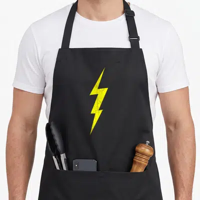 Lightning bolt pencil apron - Single yellow lightning bolt with distressed texture on gray background — shown on a black cotton canvas apron against a white background