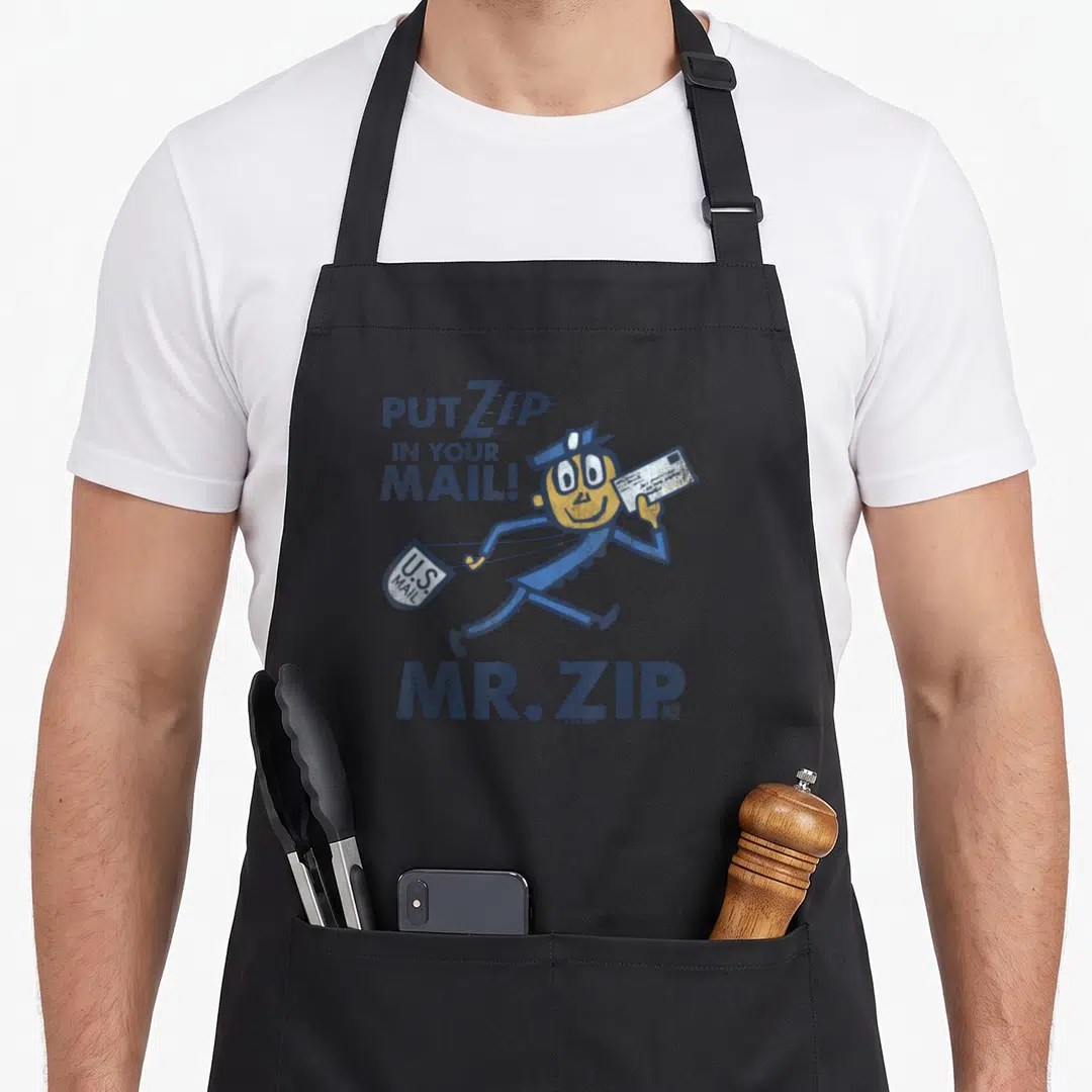 Funny zip usps aprons - Retro Mr. Zip character running with mail bag and slogan text — shown on a black cotton canvas apron against a white background