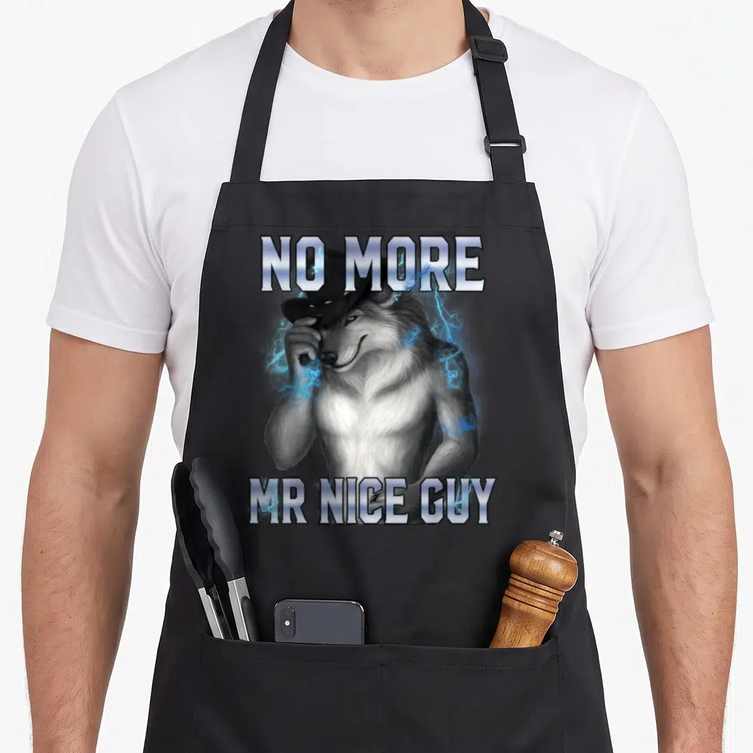 Meme alpha apron - Realistic wolf wearing black hat surrounded by blue lightning with NO MORE MR NICE GUY text — shown on a black cotton canvas apron against a white background
