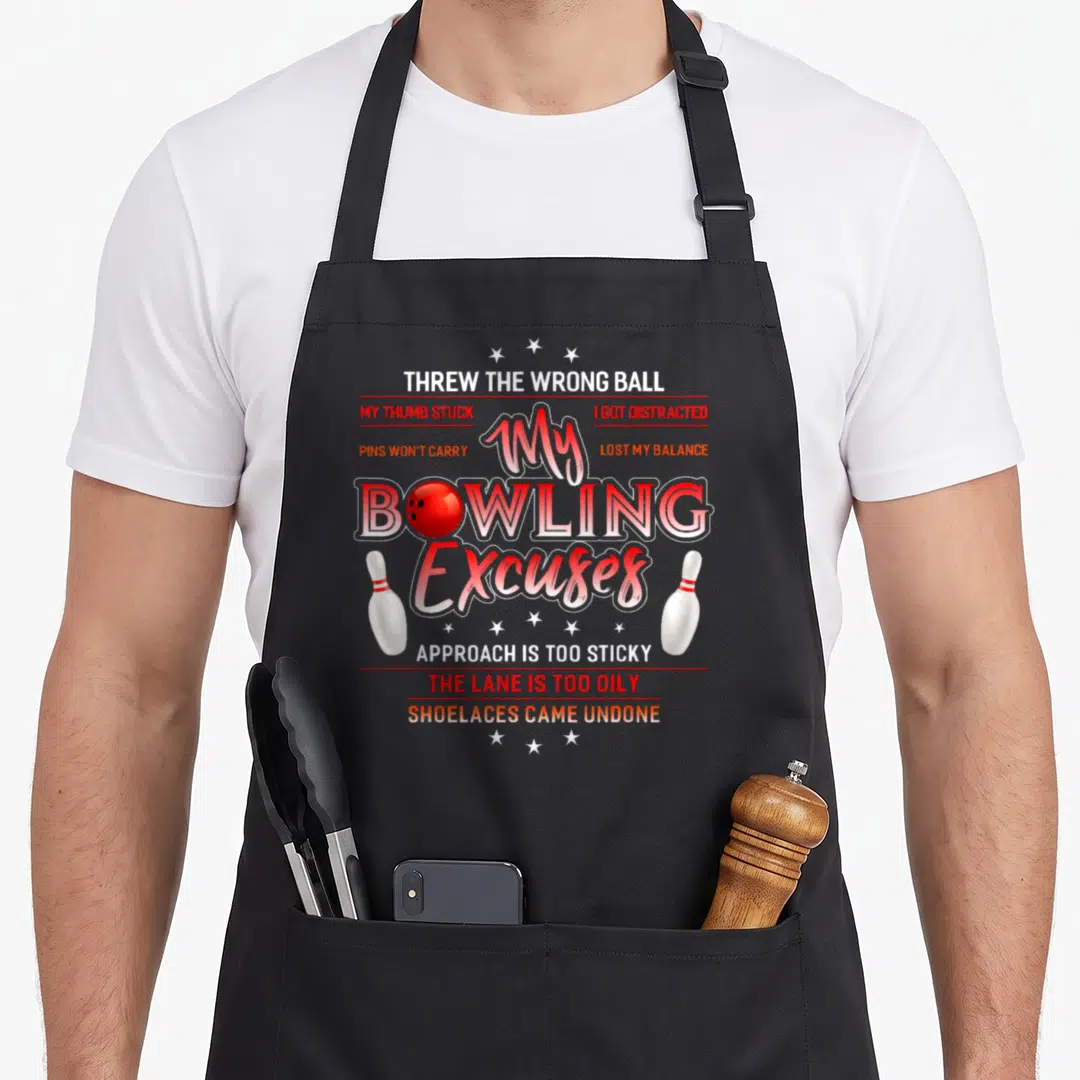 Funny excuse bowling apron - My BOWLING Excuses text with red ball, white pins, and excuse phrases — shown on a black cotton canvas apron against a white background