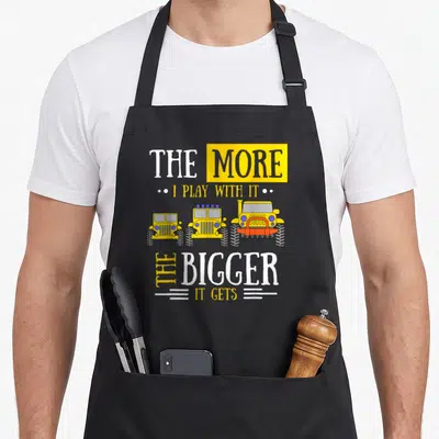 Play owner apron - Three yellow cartoon jeeps increasing in size with white and yellow text — shown on a black cotton canvas apron against a white background