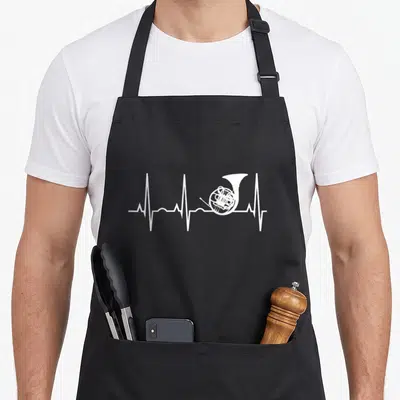 Heartbeat french apron - White ECG heartbeat line with french horn integrated into the pulse wave — shown on a black cotton canvas apron against a white background