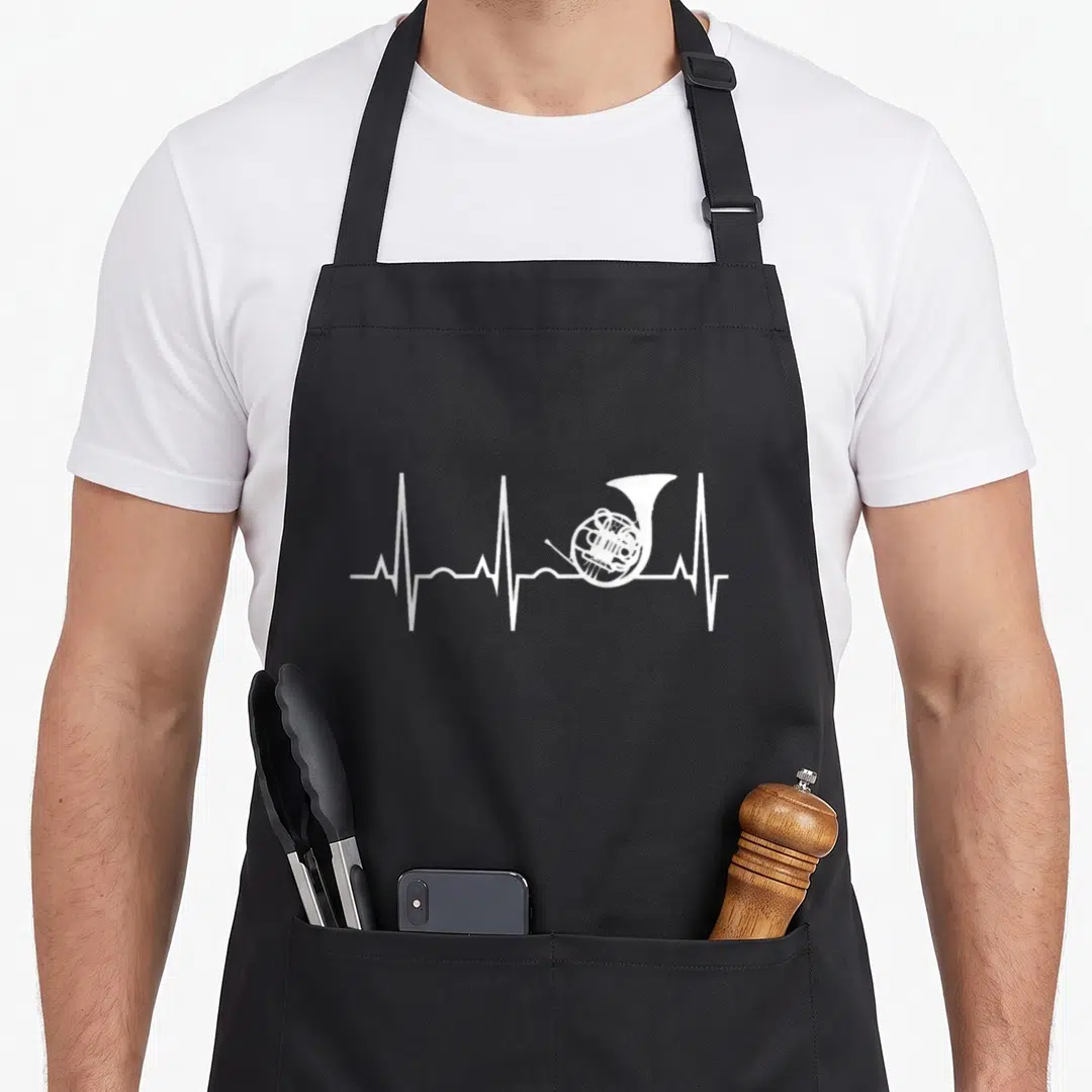 Heartbeat french apron - White ECG heartbeat line with french horn integrated into the pulse wave — shown on a black cotton canvas apron against a white background