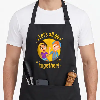 Blippi novelty apron - Two children in yellow circle with Let's all go together text and stars — shown on a black cotton canvas apron against a white background
