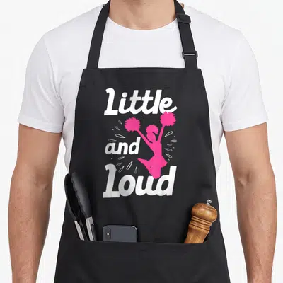 Cheer cheerleader cheerleading accessories stuff apron - Pink cartoon cheerleader jumping between white Little and Loud — shown on a black cotton canvas apron against a white background