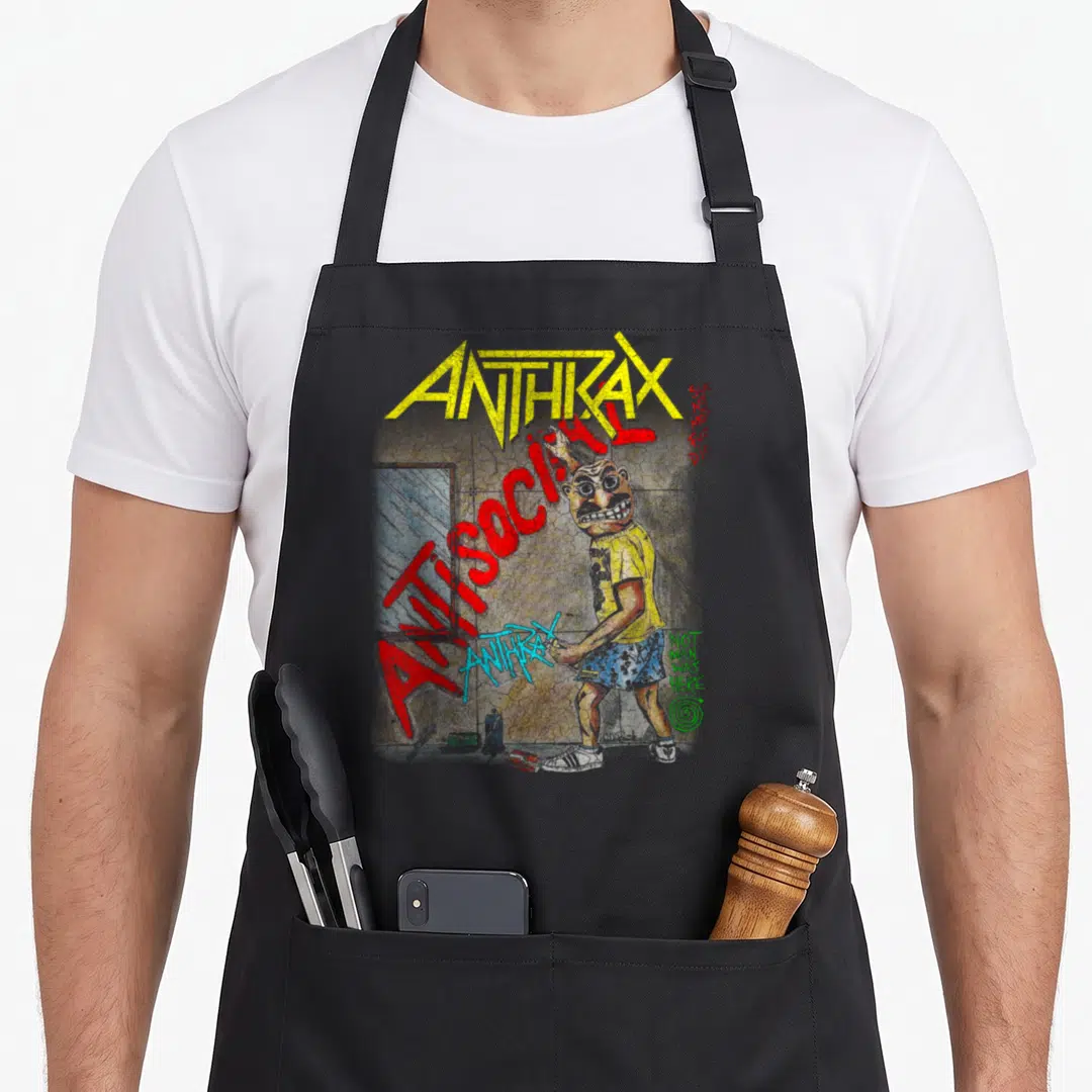 Anthrax antisocial apron - Cartoon man with spray can near cracked wall with ANTHRAX and ANTISOCIAL text — shown on a black cotton canvas apron against a white background