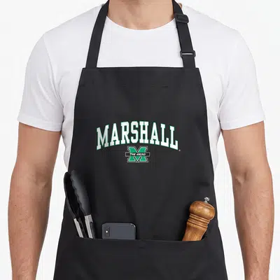 Arch marshalls apron - Arched MARSHALL text above green M with black bar reading THE HERD in white — shown on a black cotton canvas apron against a white background