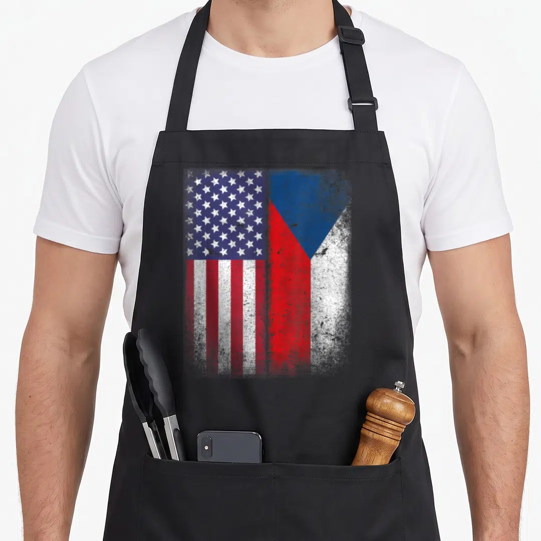 Republic american flag apron - Two distressed flags side by side in blue white and red — shown on a black cotton canvas apron against a white background
