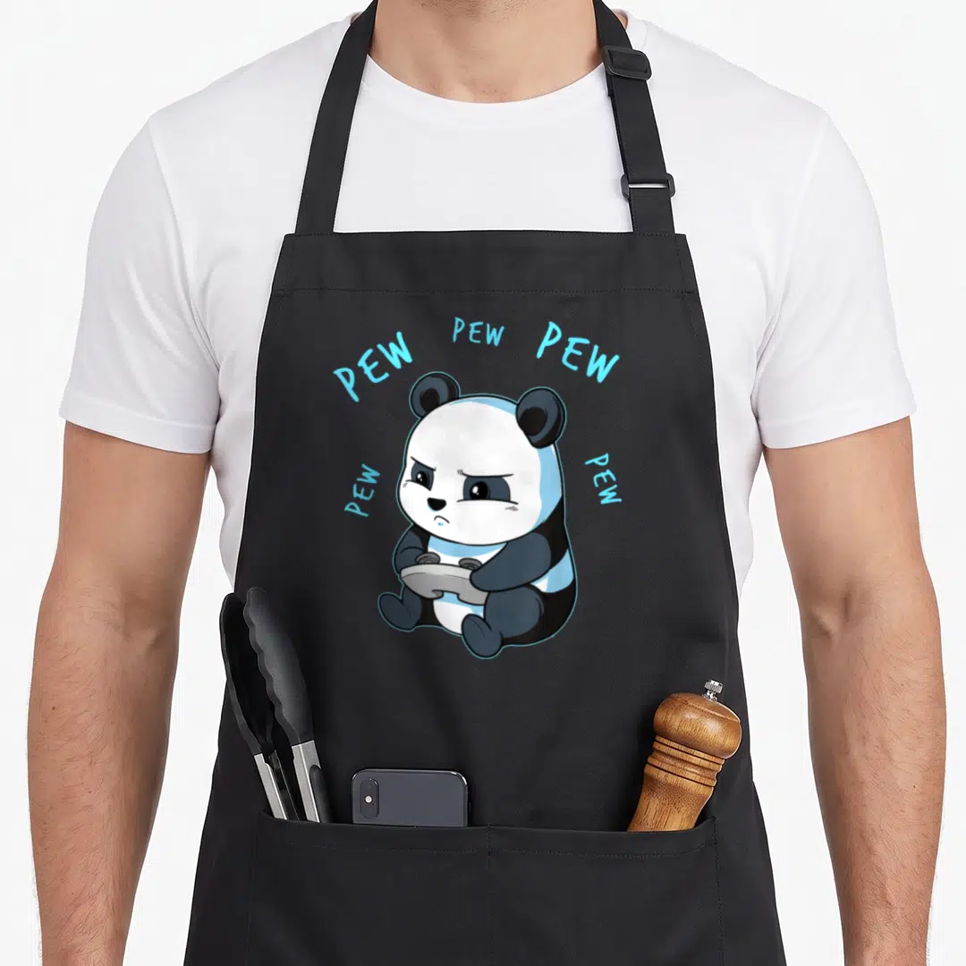 Netter video game apron - Cartoon panda holding grey controller with light blue PEW text arching above in black white — shown on a black cotton canvas apron against a white background
