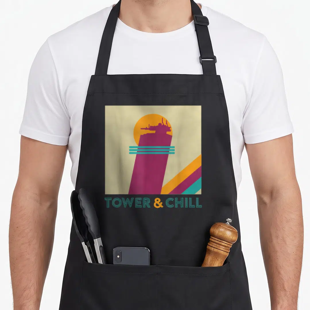 Tower hunter apron - Retro purple tower silhouette with teal lines and TOWER & CHILL text on beige background — shown on a black cotton canvas apron against a white background