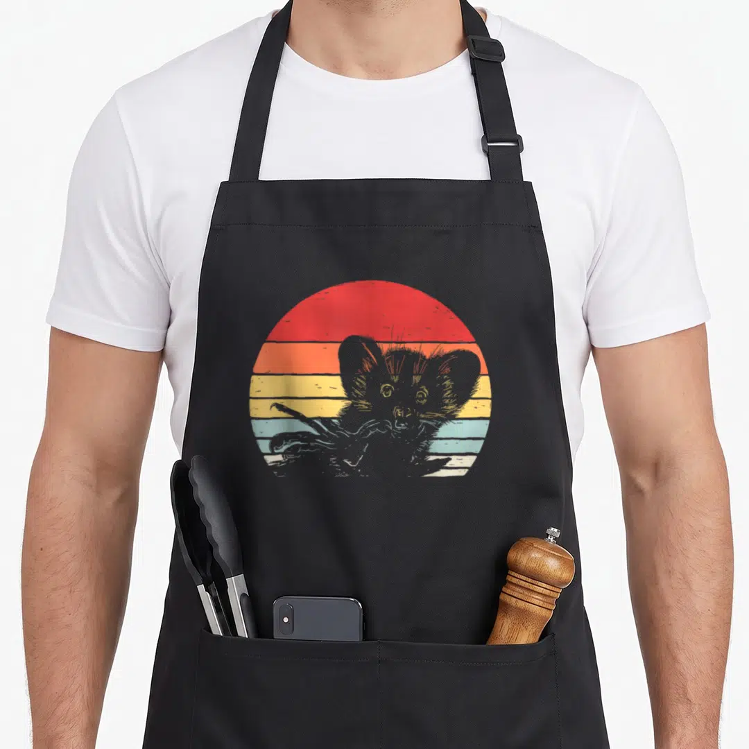 Fingered aye apron - Grey lemur with long fingers against red orange yellow blue striped retro sunset — shown on a black cotton canvas apron against a white background