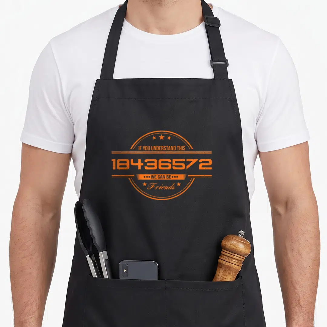 Vintage best friend aprons - Orange distressed circular badge with 18436572 firing order text and stars — shown on a black cotton canvas apron against a white background