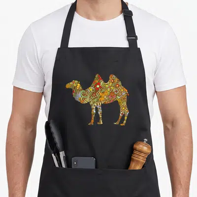 Colourful floral apron - Camel silhouette filled with brown red yellow green and blue floral swirl patterns — shown on a black cotton canvas apron against a white background