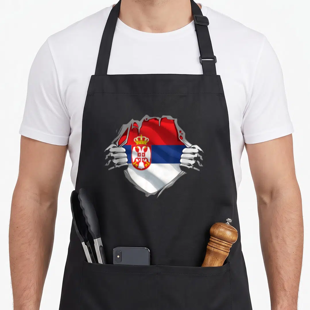 Serbian croatian girl apron - Two hands tearing grey surface to reveal red blue white Serbian flag with coat of arms — shown on a black cotton canvas apron against a white background