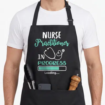 Practitioner nursing apron - Nurse Practitioner In Progress Loading text with white stethoscope and mint green progress — shown on a black cotton canvas apron against a white background