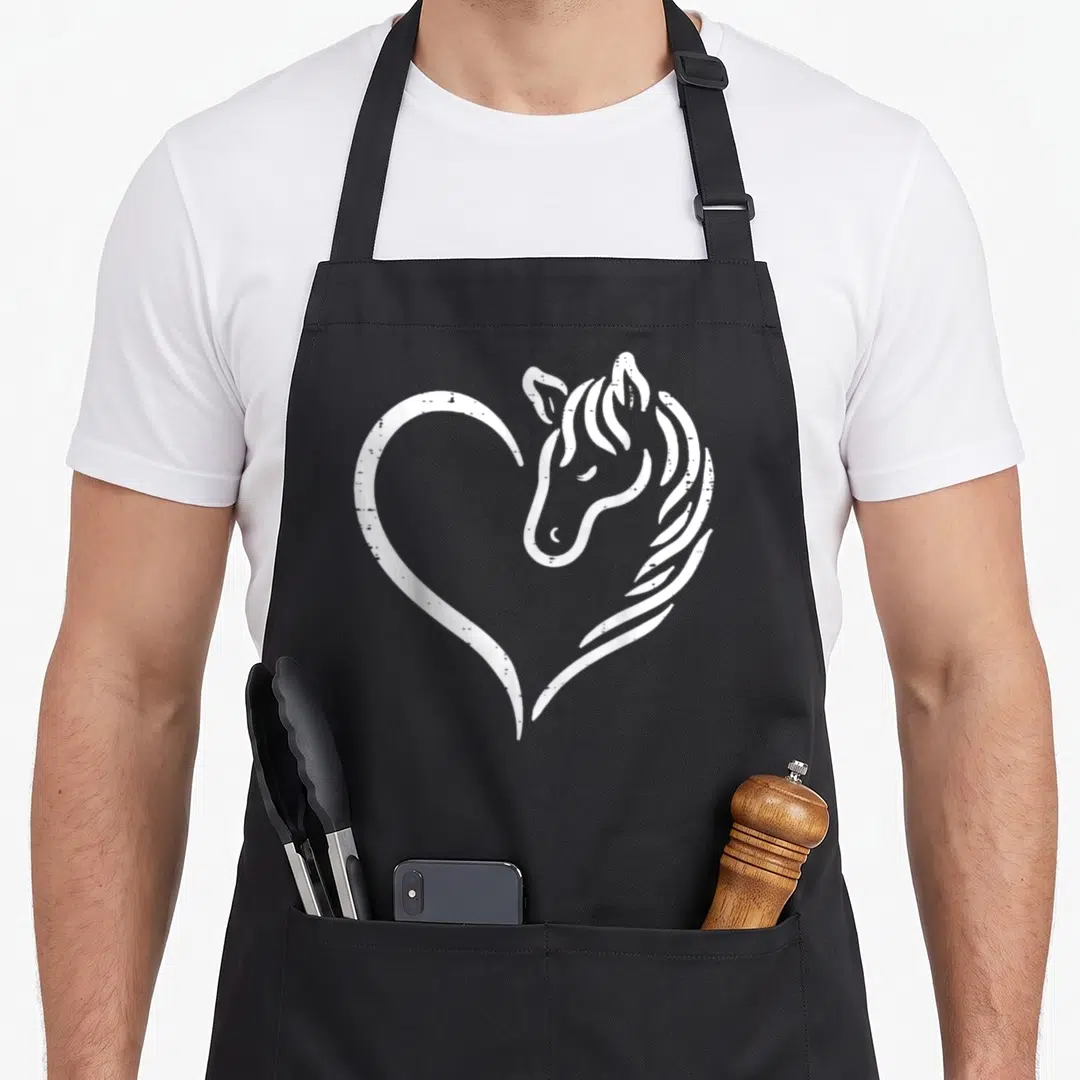 Cool equestrian horse apron - White line art heart shape formed by a single continuous line integrating a horse head — shown on a black cotton canvas apron against a white background