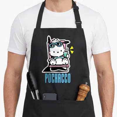 Pochacco summer aprons - Cartoon white dog in pink chair with blue sunglasses and drink, blue POCHACCO text — shown on a black cotton canvas apron against a white background