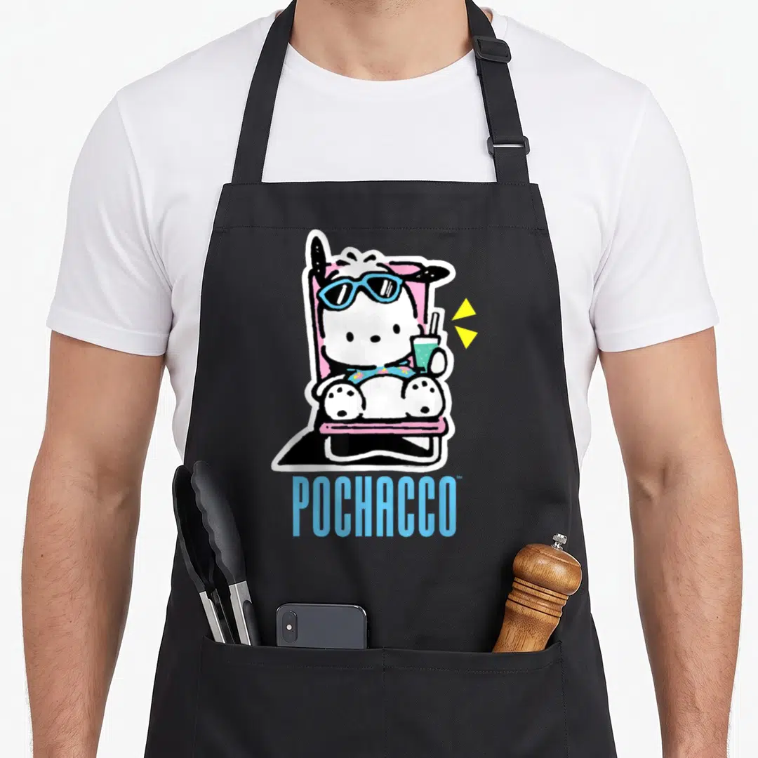 Pochacco summer aprons - Cartoon white dog in pink chair with blue sunglasses and drink, blue POCHACCO text — shown on a black cotton canvas apron against a white background