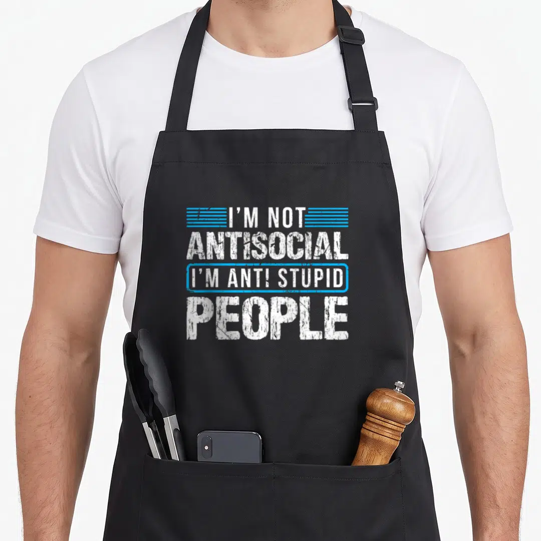 Antisocial stupid aprons - White and blue typography reading I'm not antisocial i'm anti stupid people on black apron — shown on a black cotton canvas apron against a white background