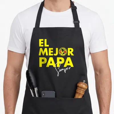 Score collection apron - Yellow text El Mejor Papa Siempre with Club America logo replacing the O in Mejor — shown on a black cotton canvas apron against a white background