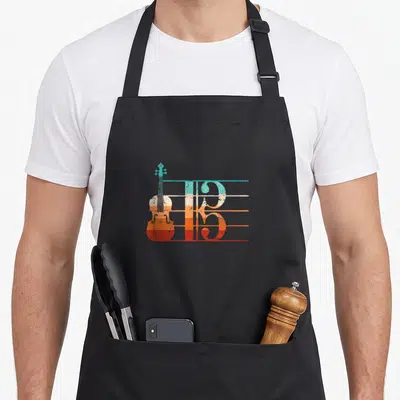 Player alto apron - Distressed violin and staff lines in teal, beige, orange, and red — shown on a black cotton canvas apron against a white background