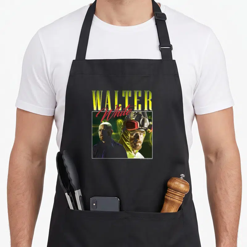 90s walter white apron - Yellow WALTER text red script White photo of man in shirt and hazmat suit green background — shown on a black cotton canvas apron against a white background