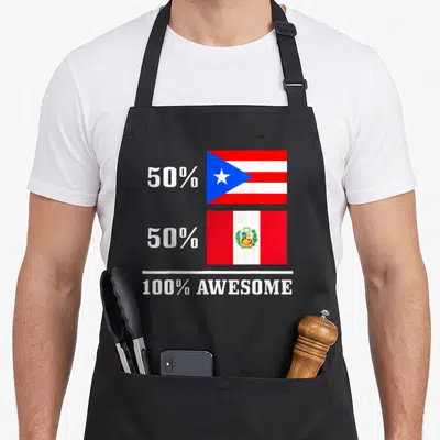 Rico peru pride apron - Two stacked flags with 50% 50% 100% AWESOME white text on black background — shown on a black cotton canvas apron against a white background
