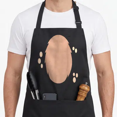 Deer halloween apron - peach oval with jagged edges and three sets of small peach dots — shown on a black cotton canvas apron against a white background