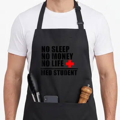 Med doctor apron - Black text NO SLEEP NO MONEY NO LIFE MED STUDENT with red cross and horizontal line — shown on a black cotton canvas apron against a white background
