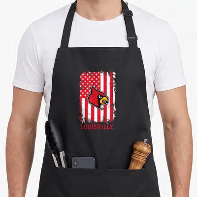 Patriotic cardinal apron - Red cardinal head on distressed US flag with LOUISVILLE text below — shown on a black cotton canvas apron against a white background