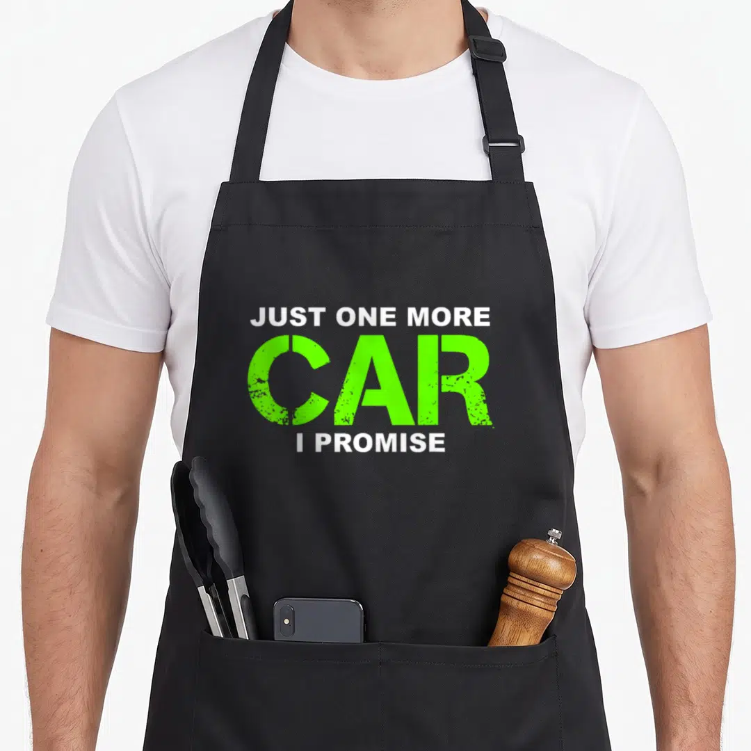 Promise enthusiast car apron - Distressed white and lime green text reading Just One More Car I Promise — shown on a black cotton canvas apron against a white background