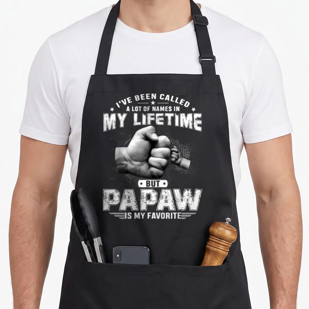 But lot of aprons - Fist bump between adult and baby hands with Papaw favorite text in distressed white font — shown on a black cotton canvas apron against a white background