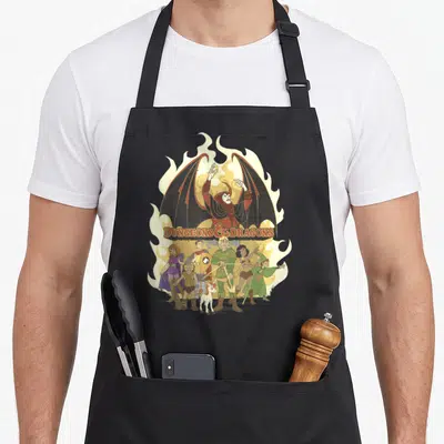 Shot flame apron - Winged demon and five fantasy characters below Dungeons & Dragons text on yellow flames — shown on a black cotton canvas apron against a white background