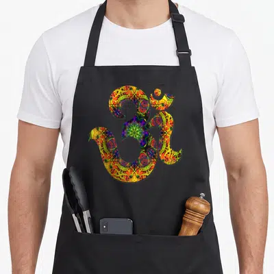 Mandala yoga om symbol apron - Large Om symbol filled with colorful yellow red green blue purple mandala pattern — shown on a black cotton canvas apron against a white background