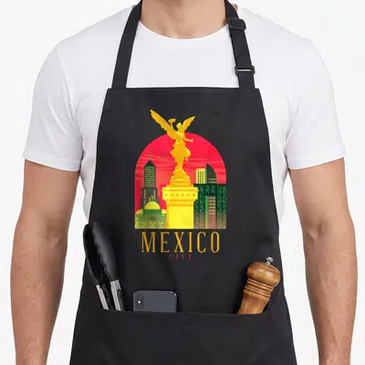 Angel mexico apron - Retro yellow Angel of Independence statue on red sun with MEXICO CITY text — shown on a black cotton canvas apron against a white background