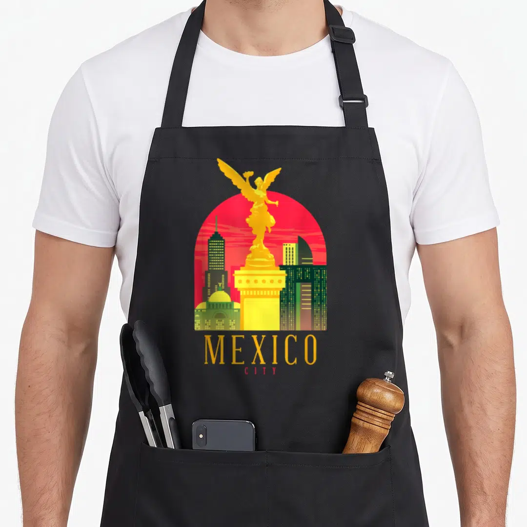 Angel mexico apron - Retro yellow Angel of Independence statue on red sun with MEXICO CITY text — shown on a black cotton canvas apron against a white background